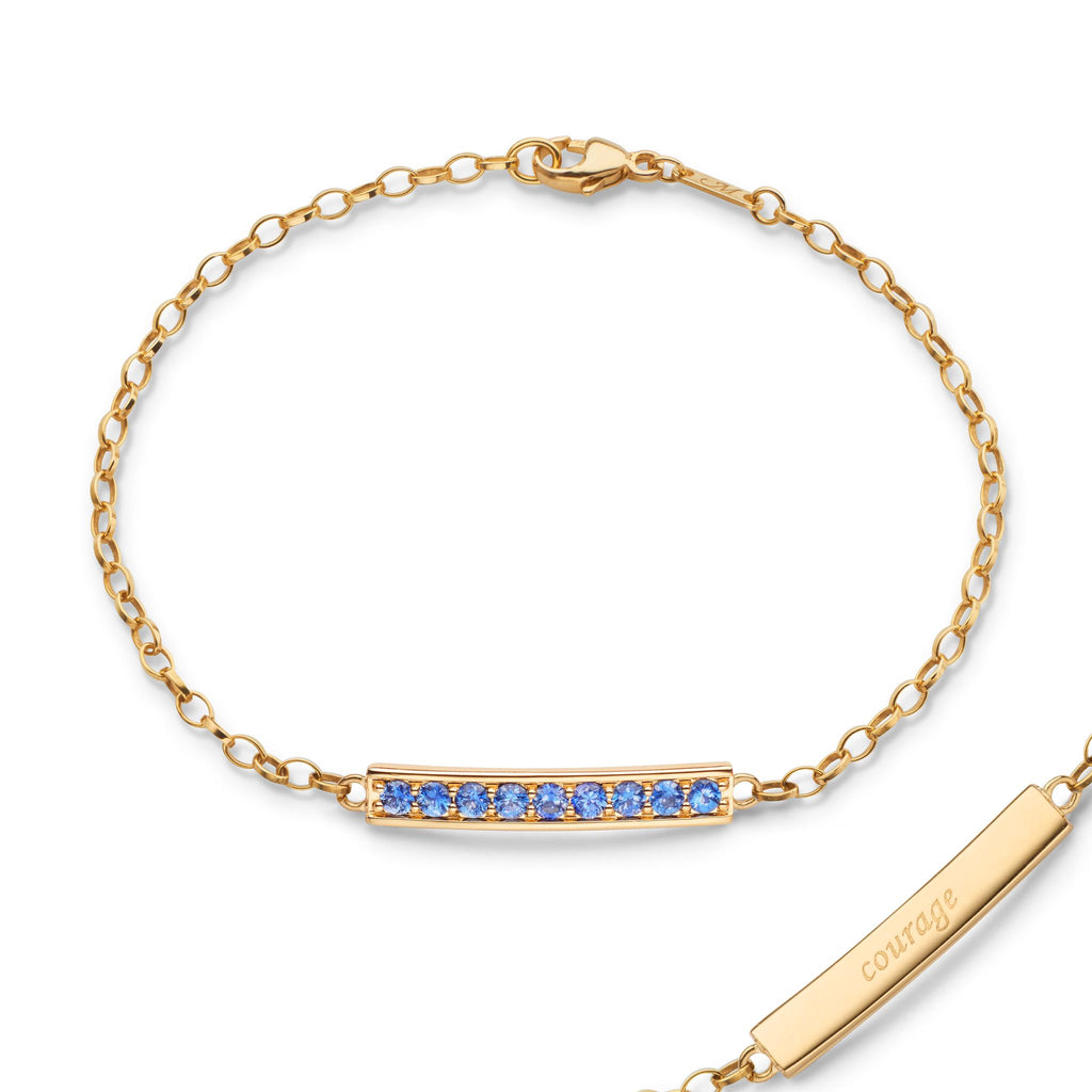 Monica Rich Kosann 18K Yellow Gold Poesy Bracelet with Channel Set with Cornflower Blue Sapphires, engraved with "Courage" - Charles Mayer